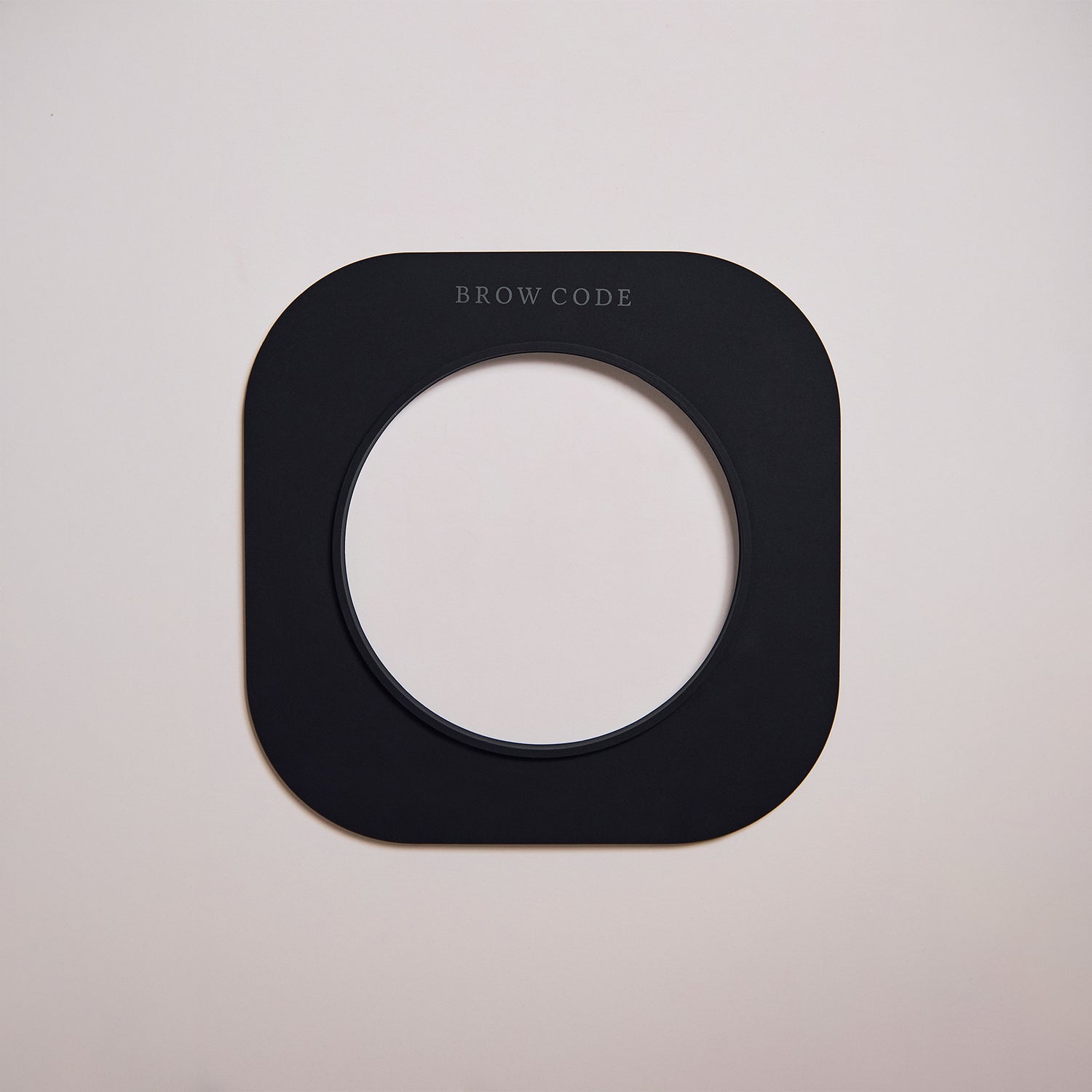 Brow Code's Wax Collar on a cream background