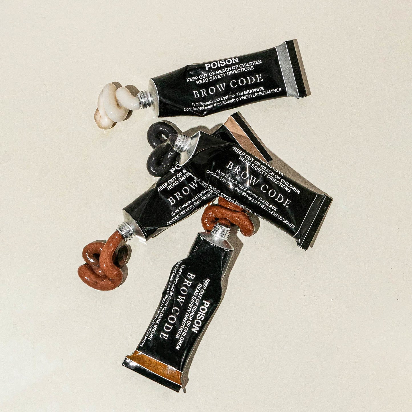 Stylised image of squeezed Brow Tint tubes