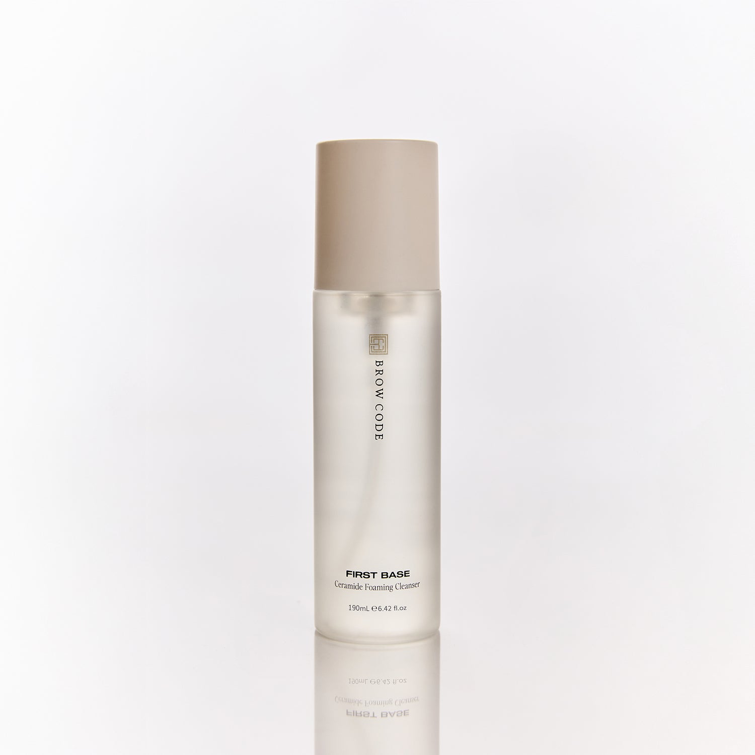 Brow Code First Base Ceramide Foaming Cleanser bottle with beige cap on a white background