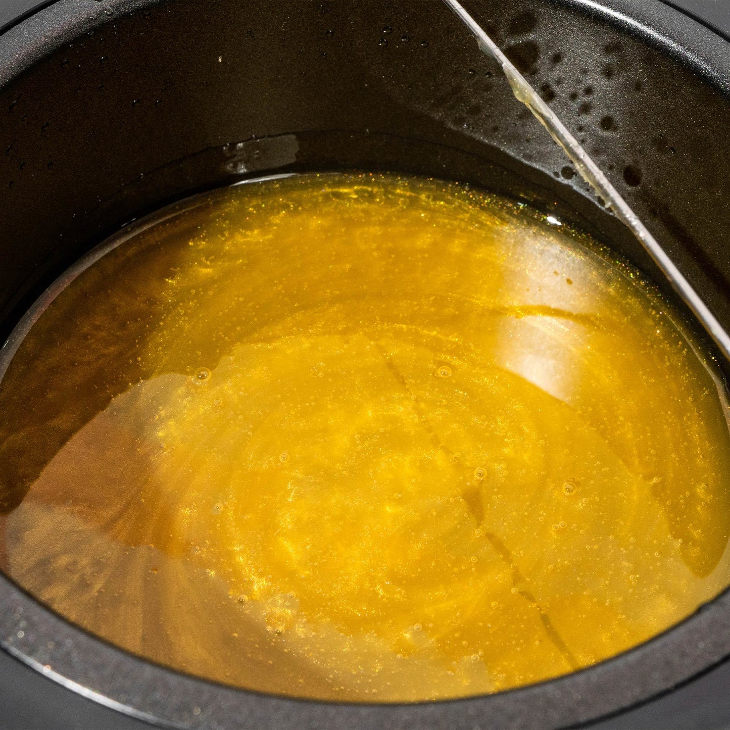 Hot wax that has been melted into a liquid