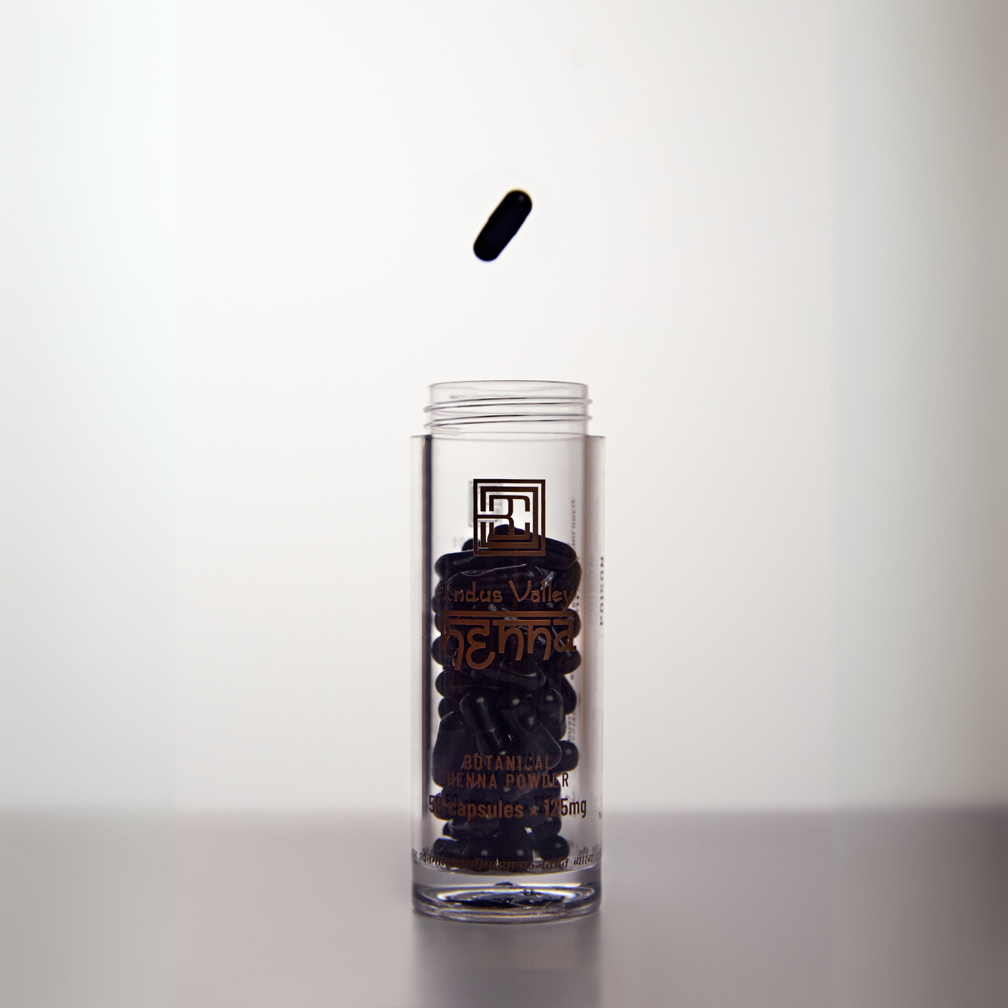 Stylised image of Henna Powder in packaging with open lid