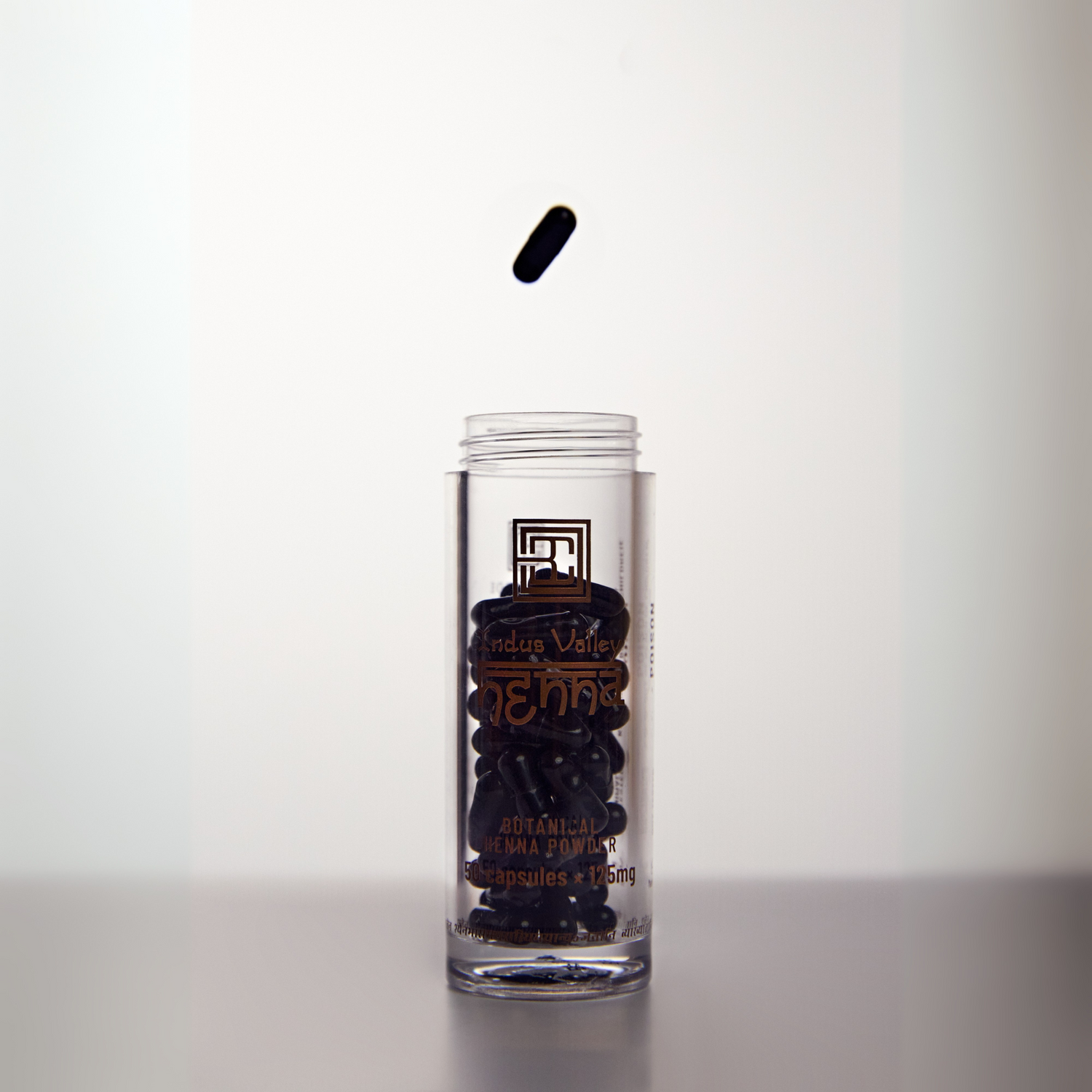 Stylised image of Henna Powder in packaging with open lid