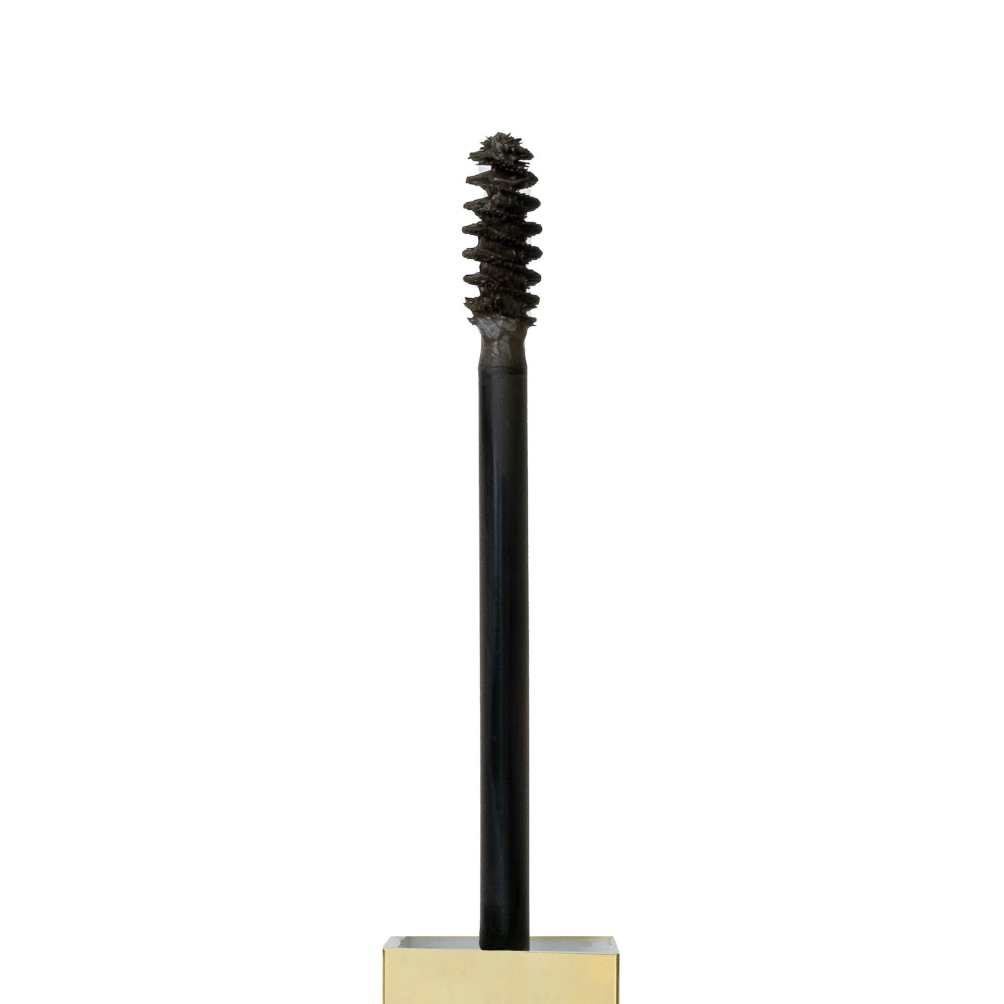 Close up shot of spoolie with Tinted Multi-Peptide Brow Gel - color-soft-brown