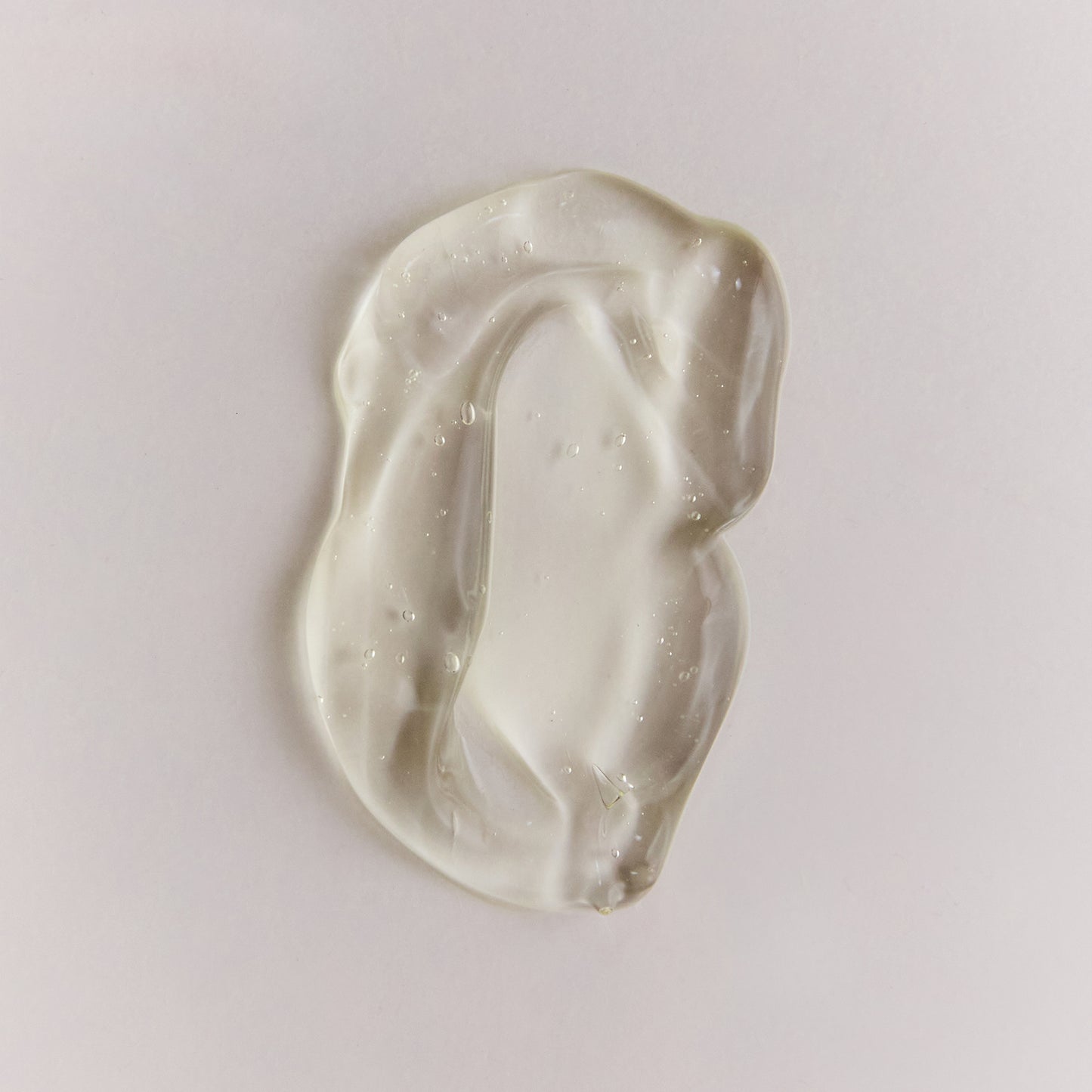 Close-up of Arch Aid Renewal Gel product texture on a soft neutral background